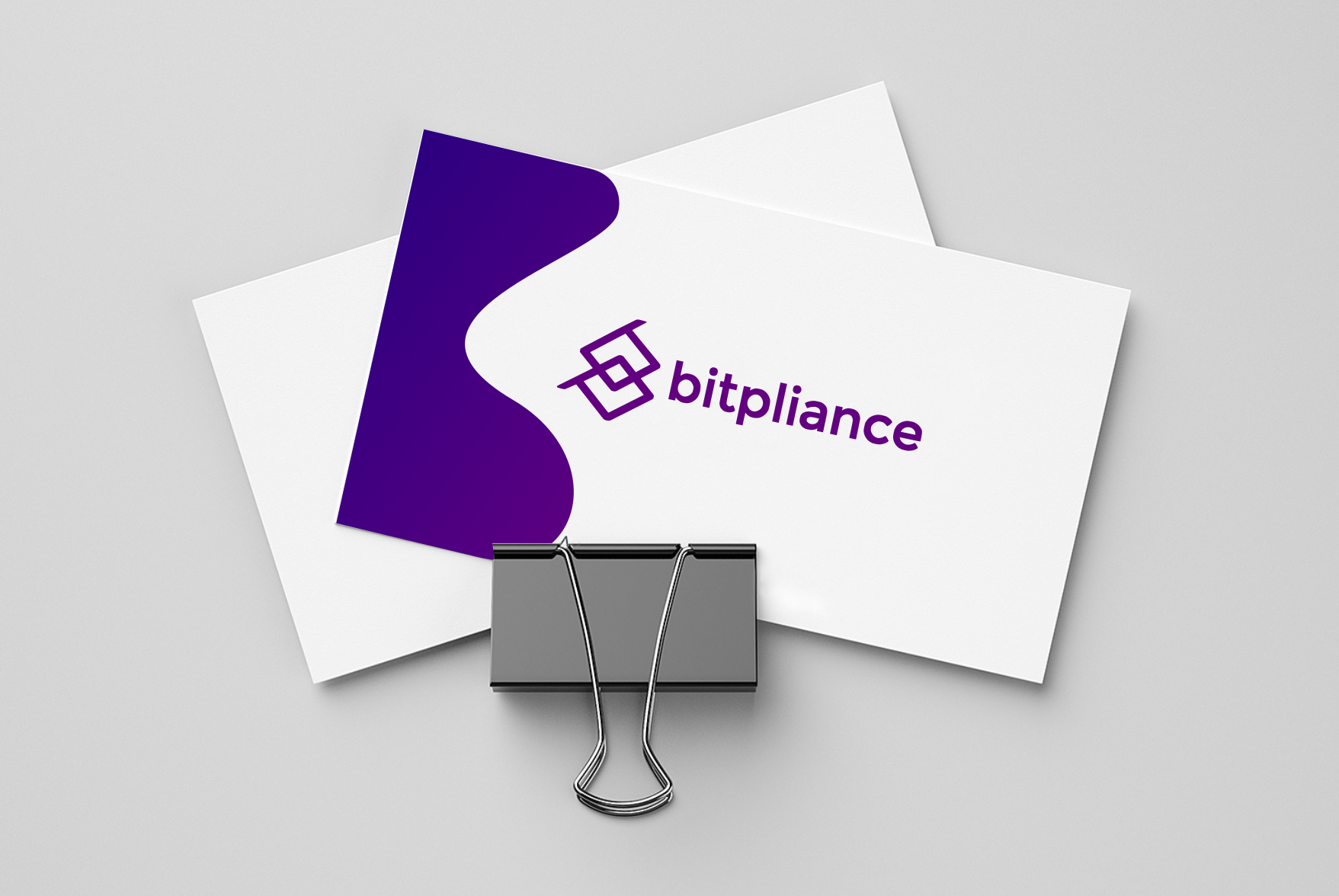 The Bitpliance logo printed on a business card
